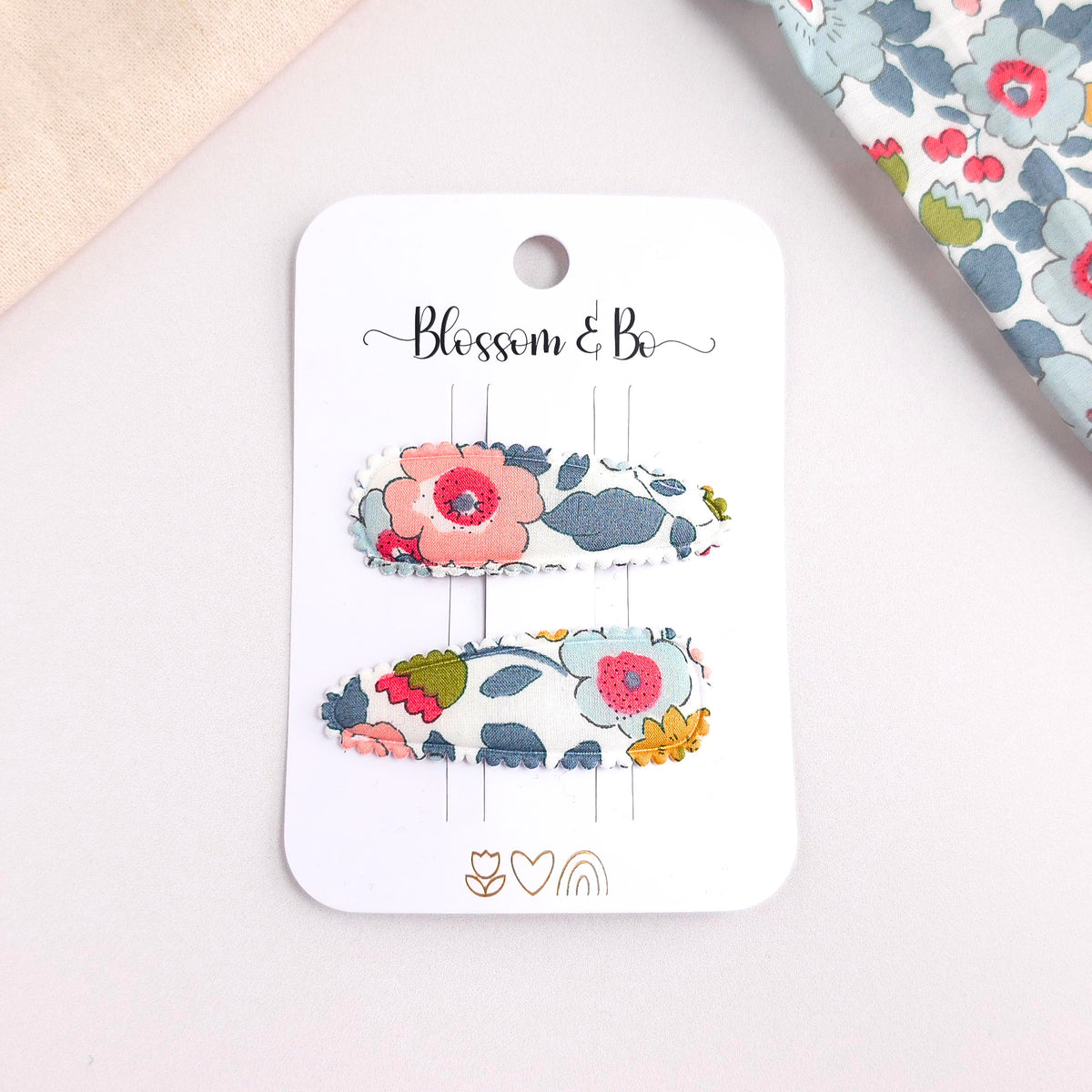 Set of two floral snap clips in a grey Liberty of London fabric