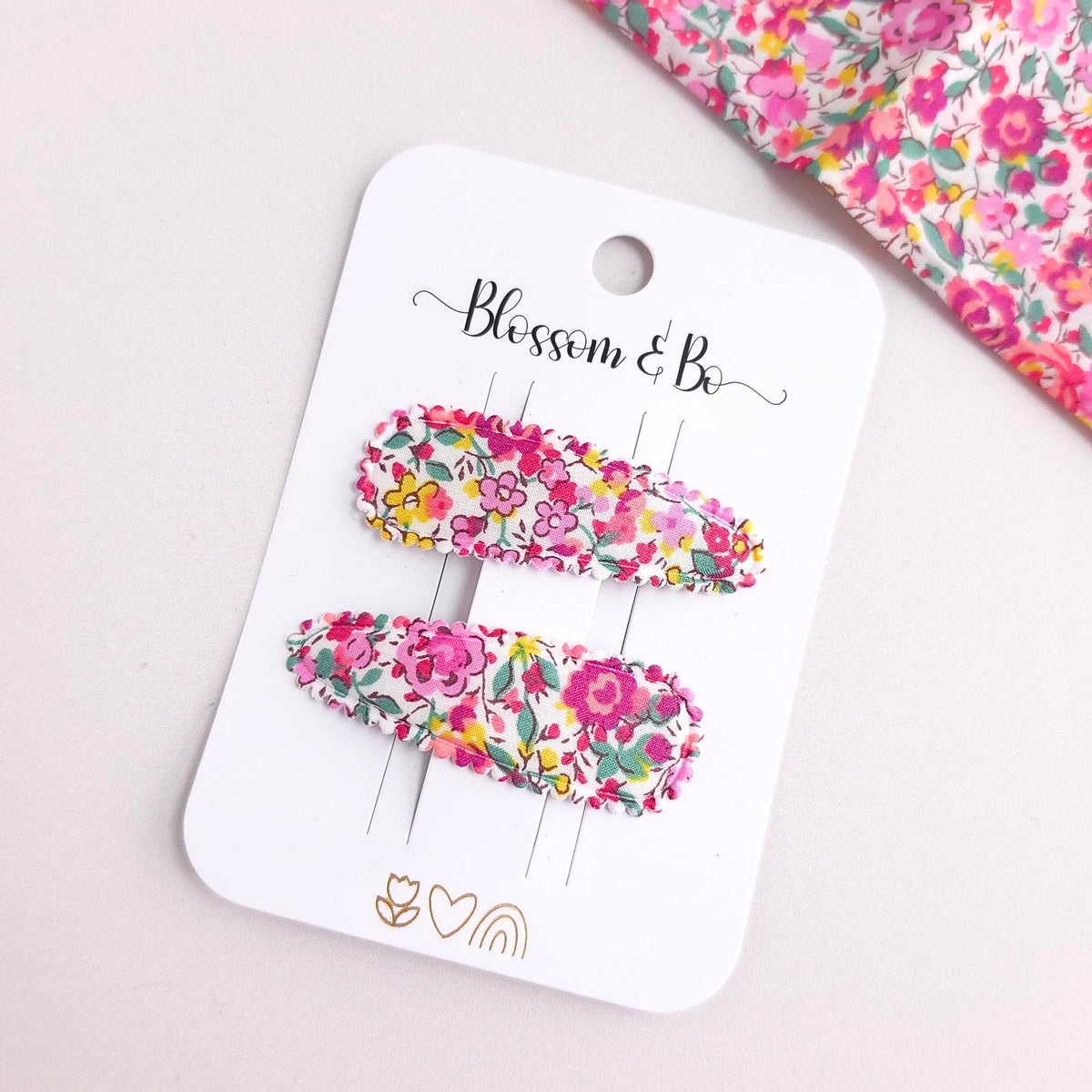 Pink Floral Snap hair clips on a 'Blossom & Co' branded card with a floral background.