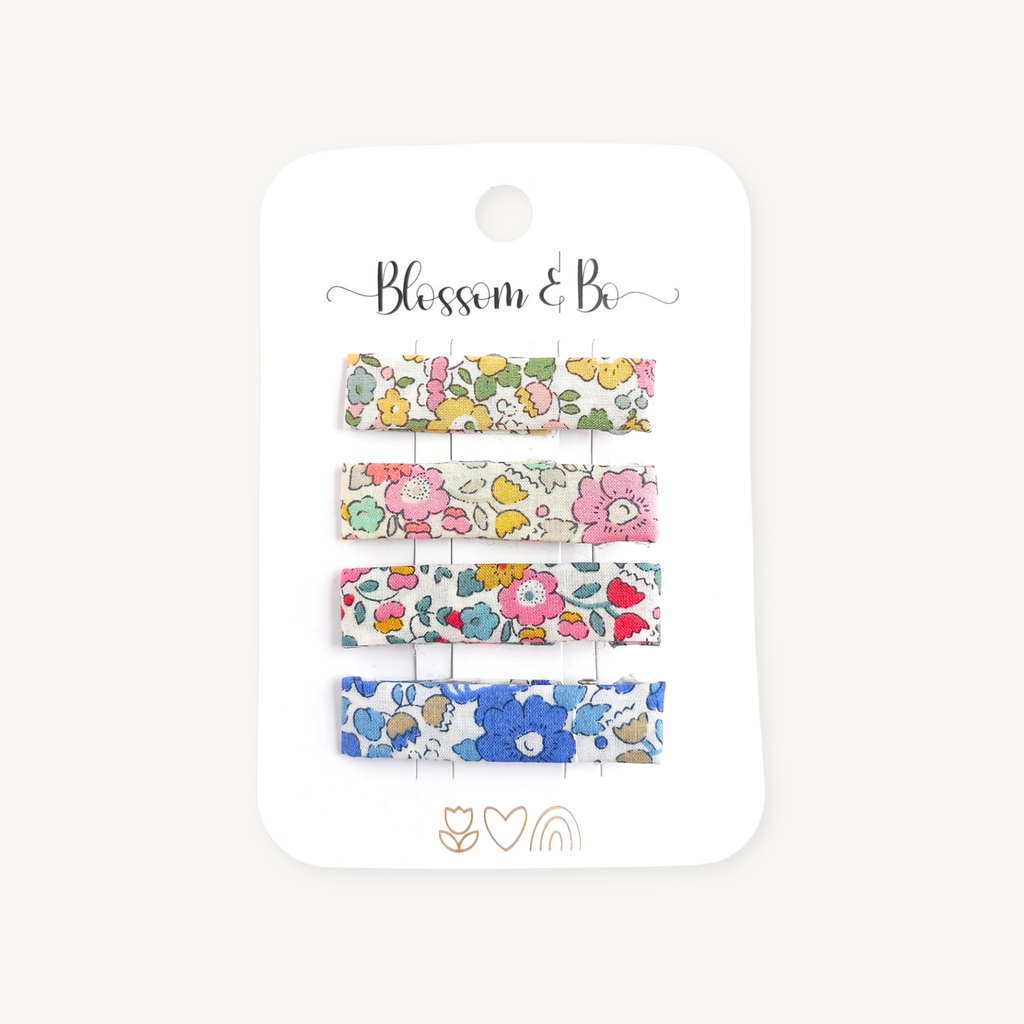 Set of four Liberty floral alligator hair clips on a Blossom & Bo display card