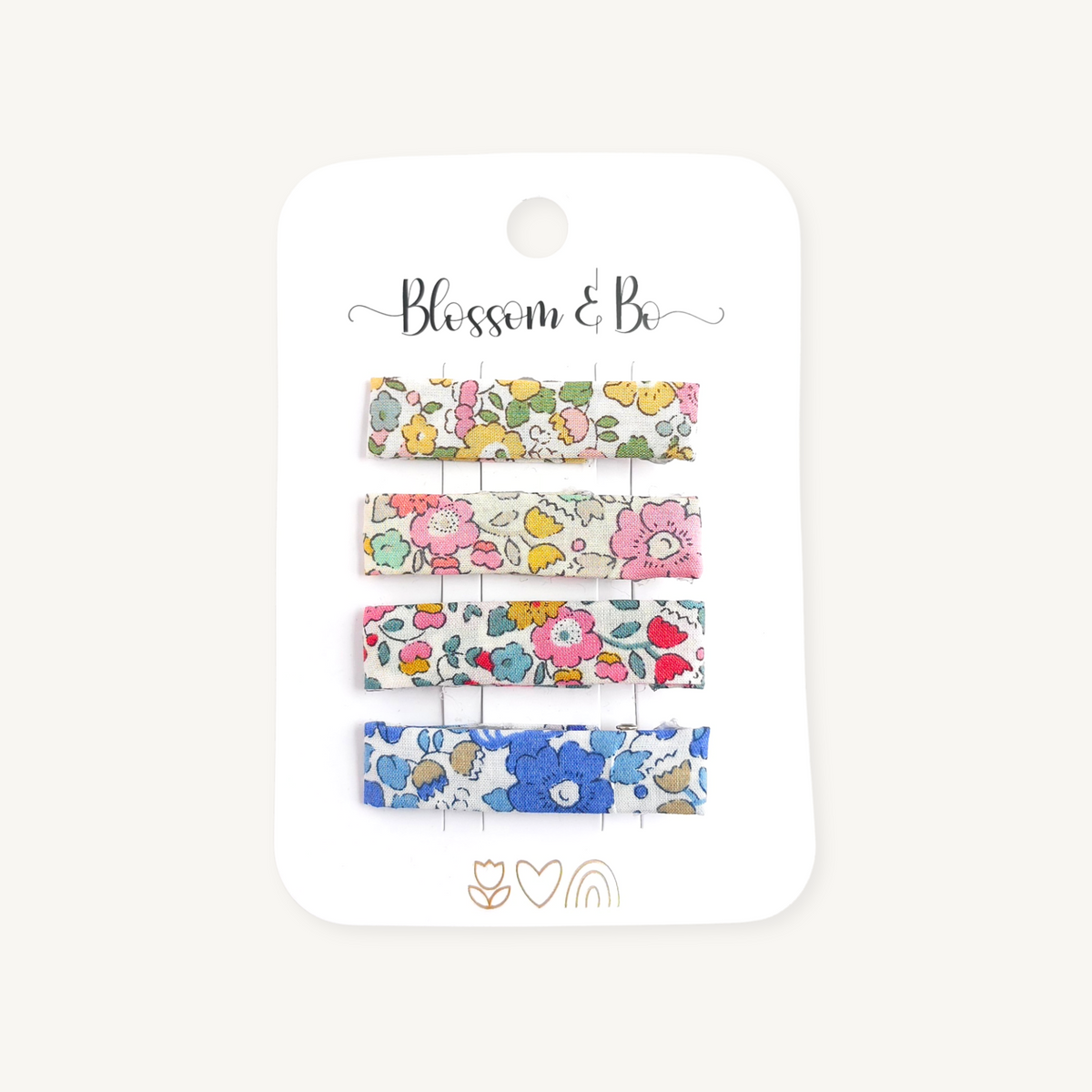 Set of four Liberty floral alligator hair clips on a Blossom & Bo display card