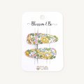 Pair of yellow Liberty floral snap clips on Blossom & Bo display card