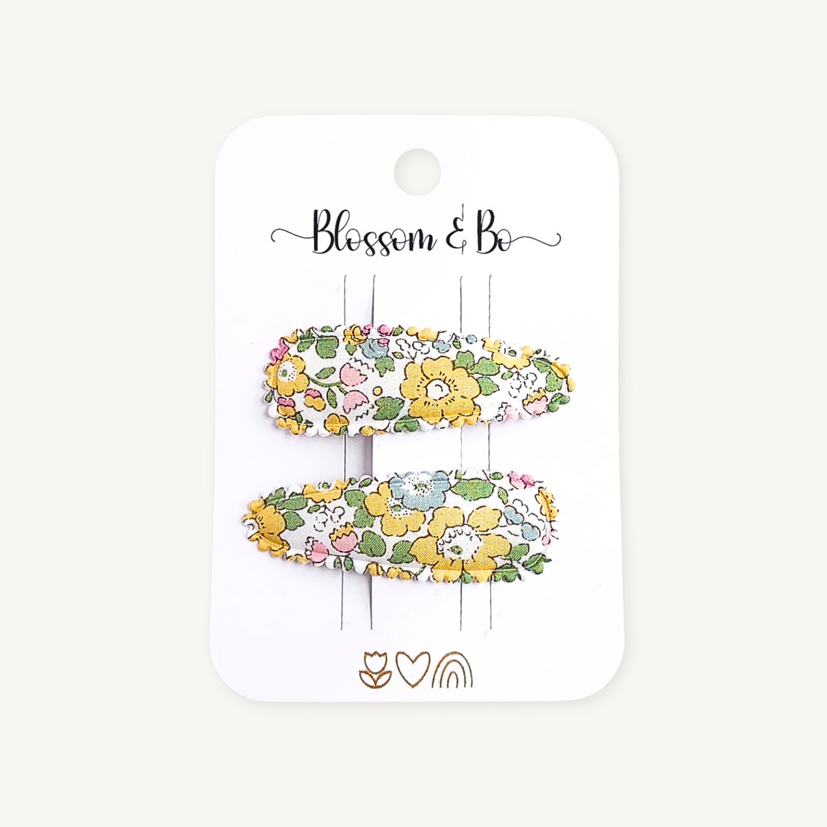 Pair of yellow Liberty floral snap clips on Blossom & Bo display card