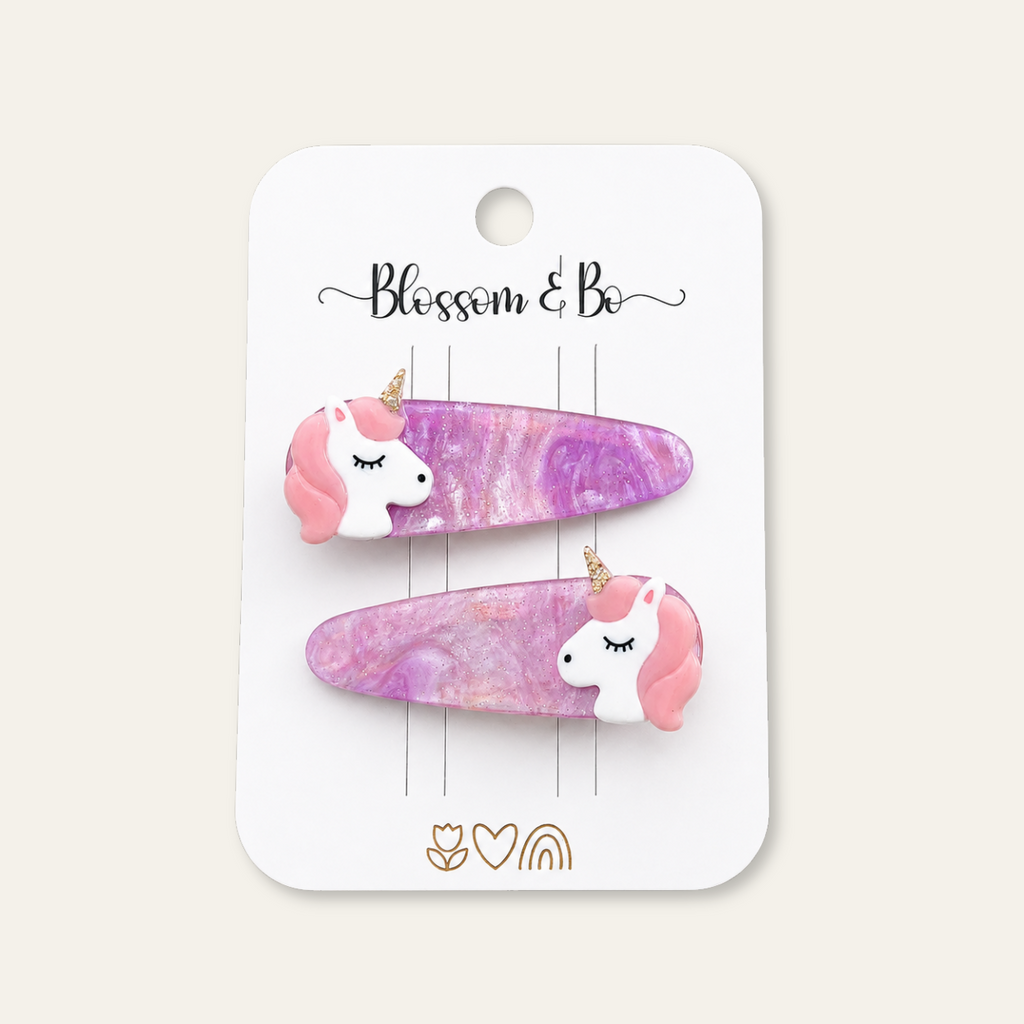 Purple unicorn hair clips for girls with pink manes and gold glitter horns