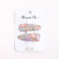 Floral hair clip set on a 'Blossom & Co' branded card against a white background