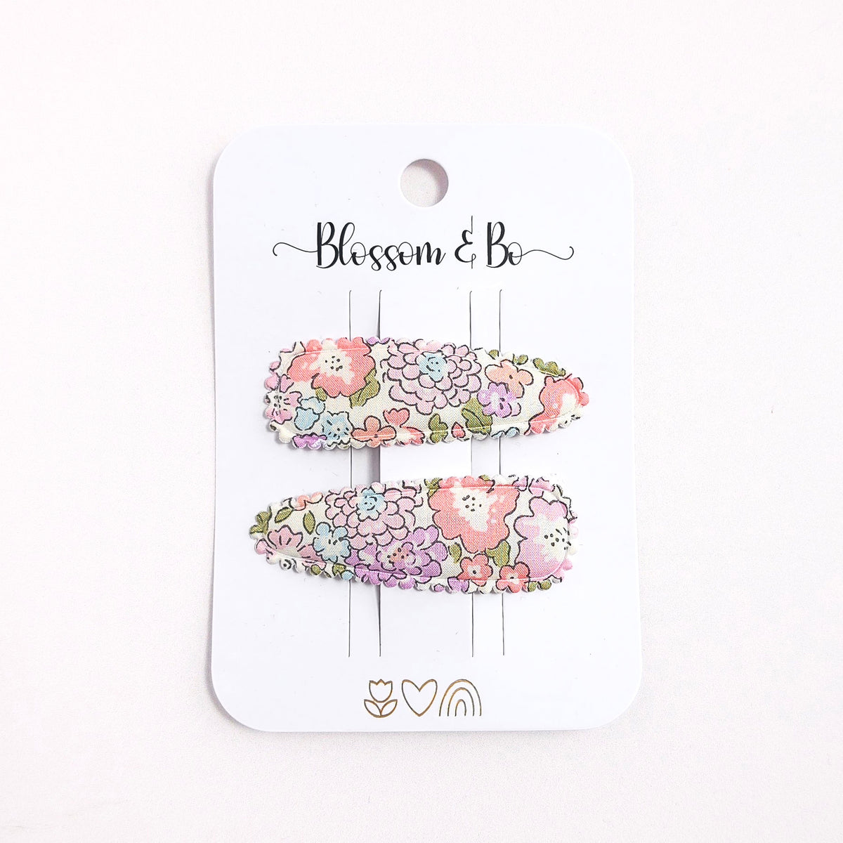 Floral hair clip set on a 'Blossom & Co' branded card against a white background