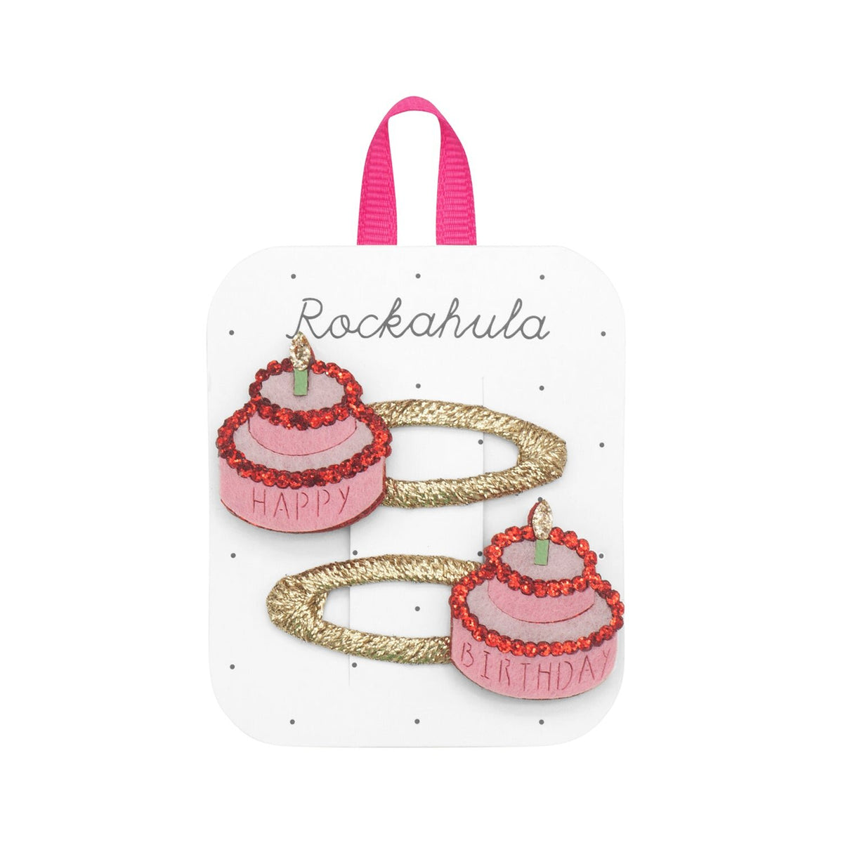 Set of hair clips with birthday cake design and 'Happy Birthday' text on a white background with 'Rockahula' branding.