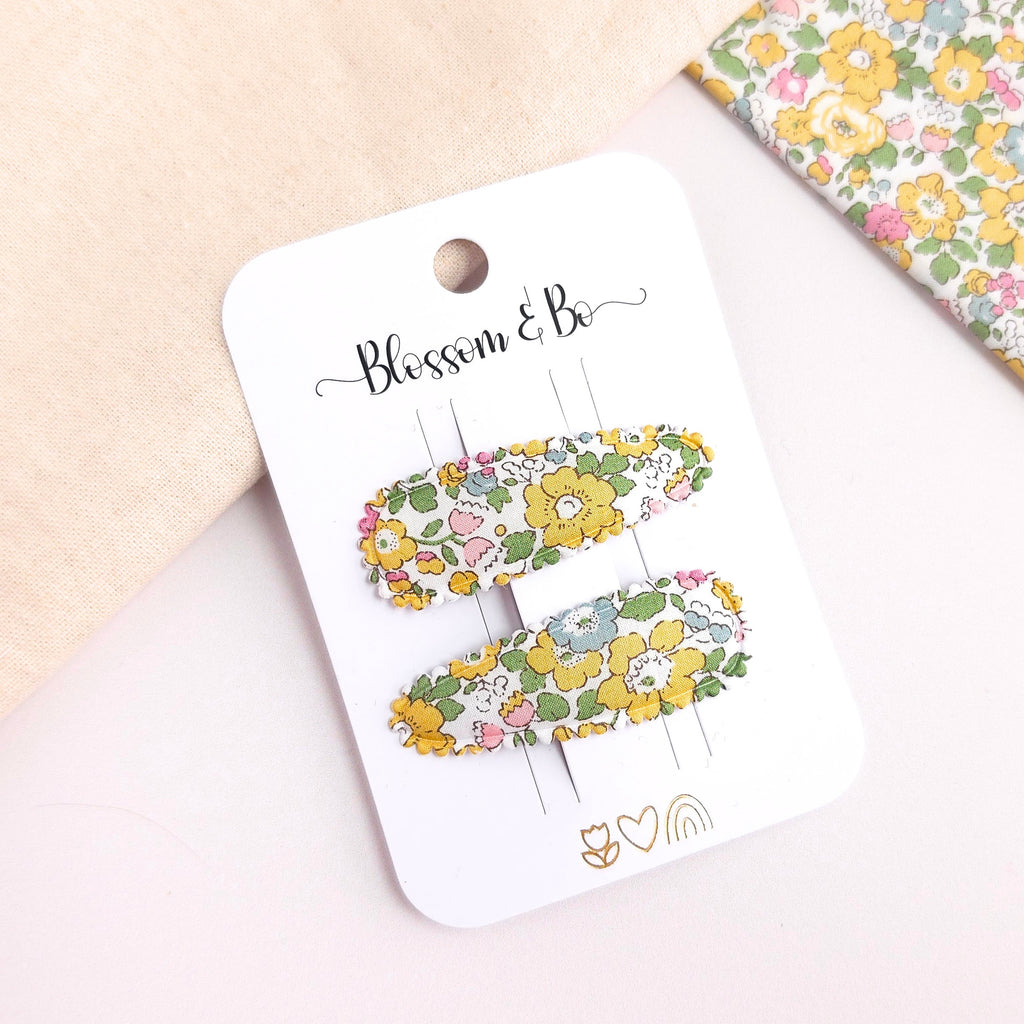Pair of children's yellow floral snap clips