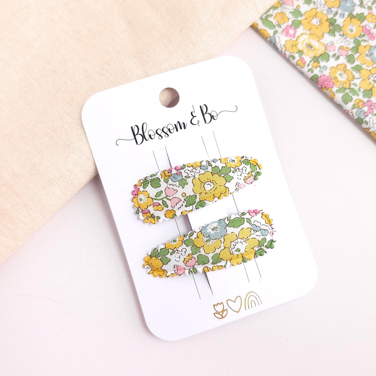 Pair of children's yellow floral snap clips