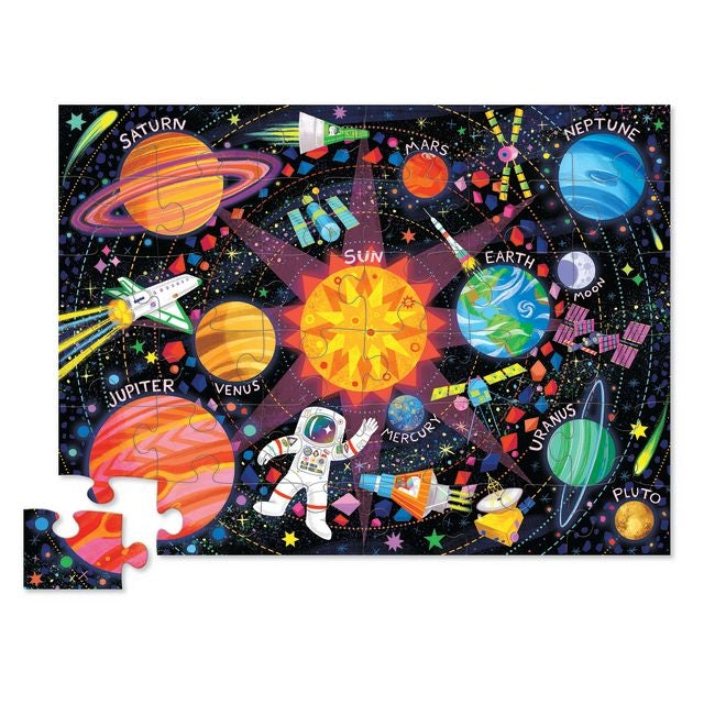 Solar system-themed puzzle with colorful planets and an astronaut on a black background