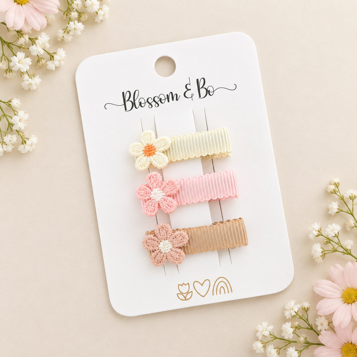Mini neutral flower hair clips with ribbon - lined alligator clips on a Blossom & Bo display card
