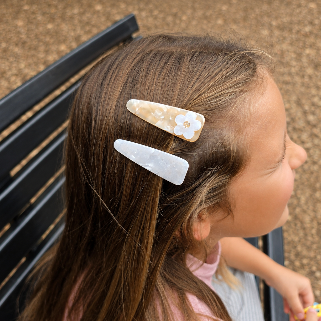 Daisy acrylic hair clips or girls shown in hair